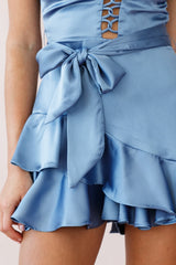 Wishful Thinking Plunging Neckline Ruffle Hem Romper Midnight Blue